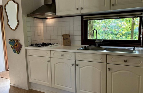 Harderwijk House | Cozy Tiny Lodge (48 m²) for 2-3 persons (2 adults and 1 child) with basic facilities, garden and terrace.