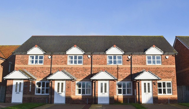 Modern property with an enclosed garden two minutes from a sandy beach. in Chathill